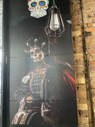 painting of woman with skull face dressed in kings clothes
